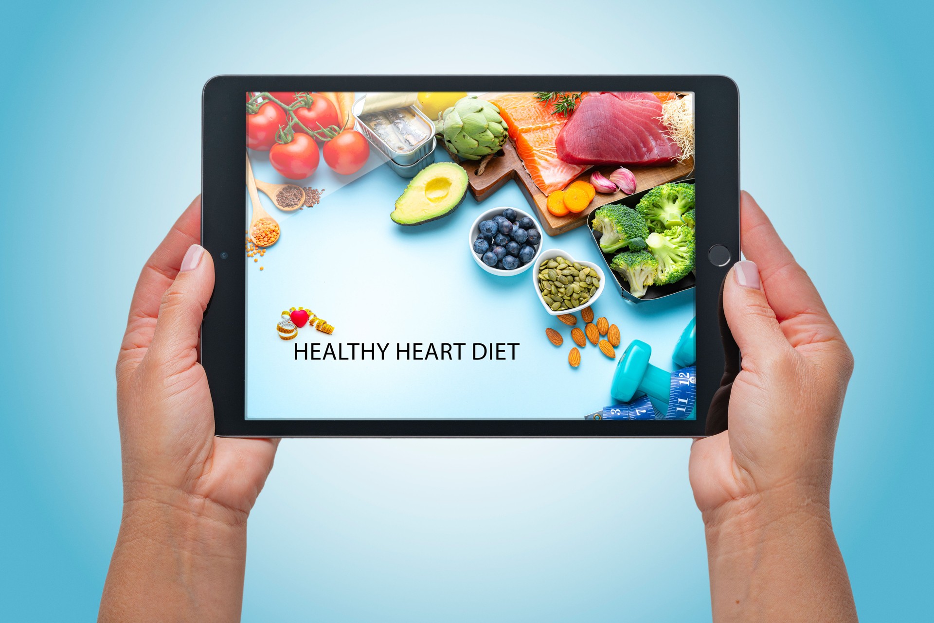 Digital tablet showing group of food for a healthy and strong heart